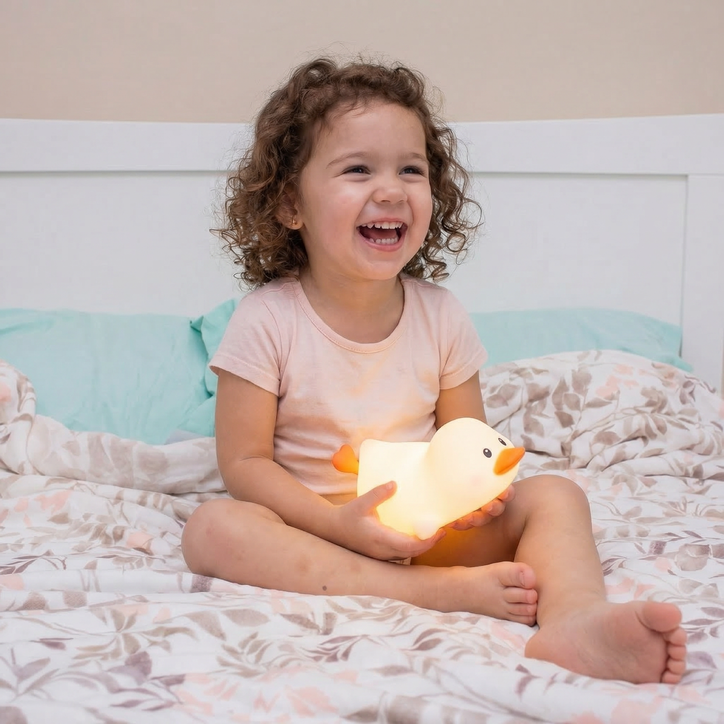 Child holding glowing duck night light for kids bedtime comfort